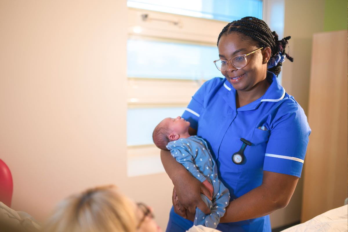 Midwife with baby